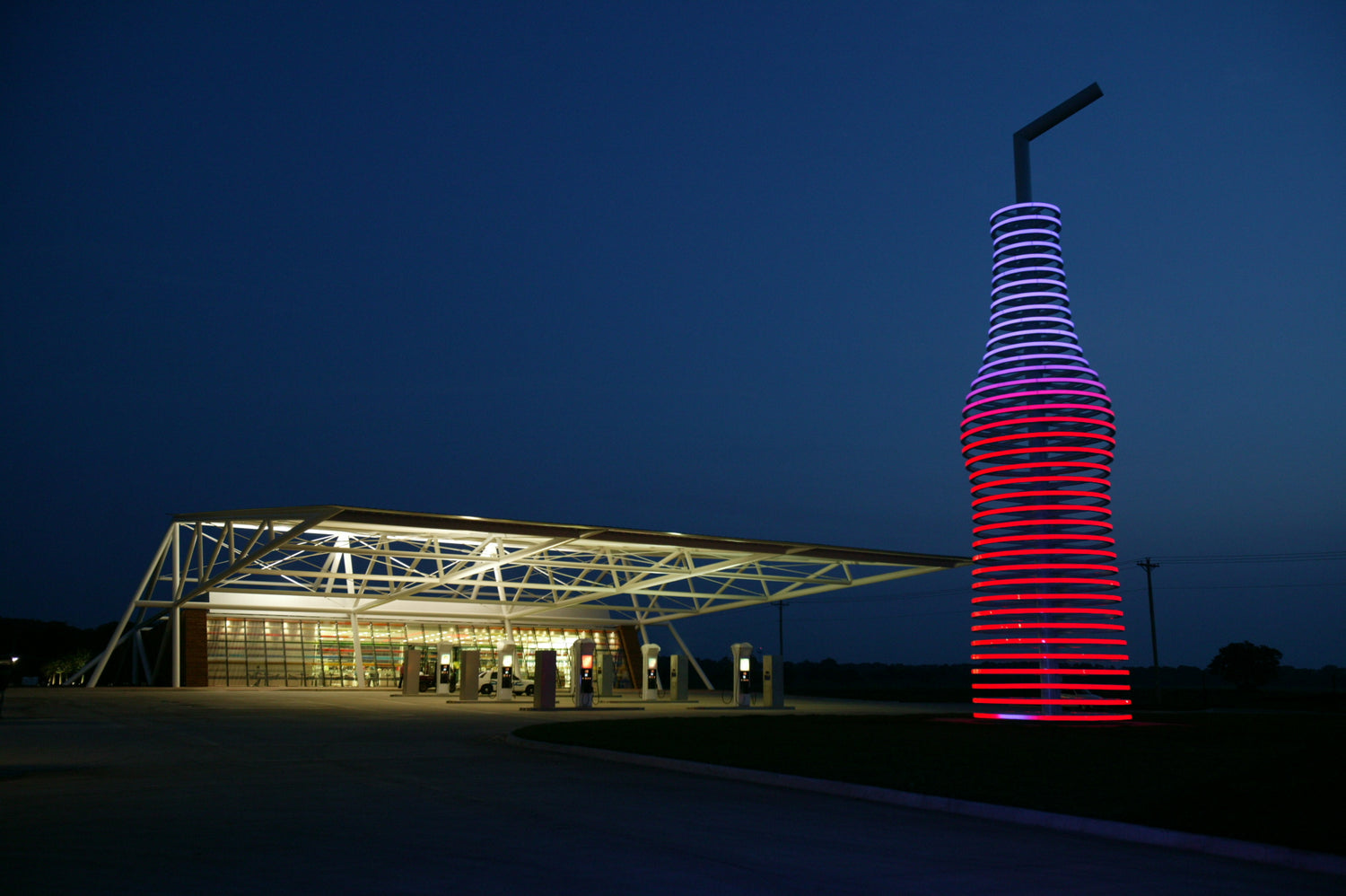 Pops 66 Arcadia Oklahoma light up neon bottle sculpture canopy gas station evening night